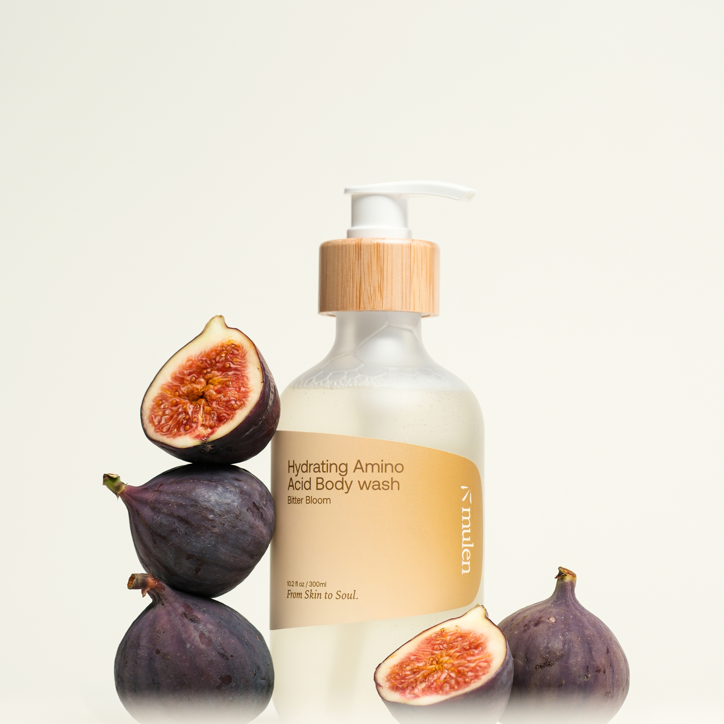 Body wash bottle with figs on a light background
